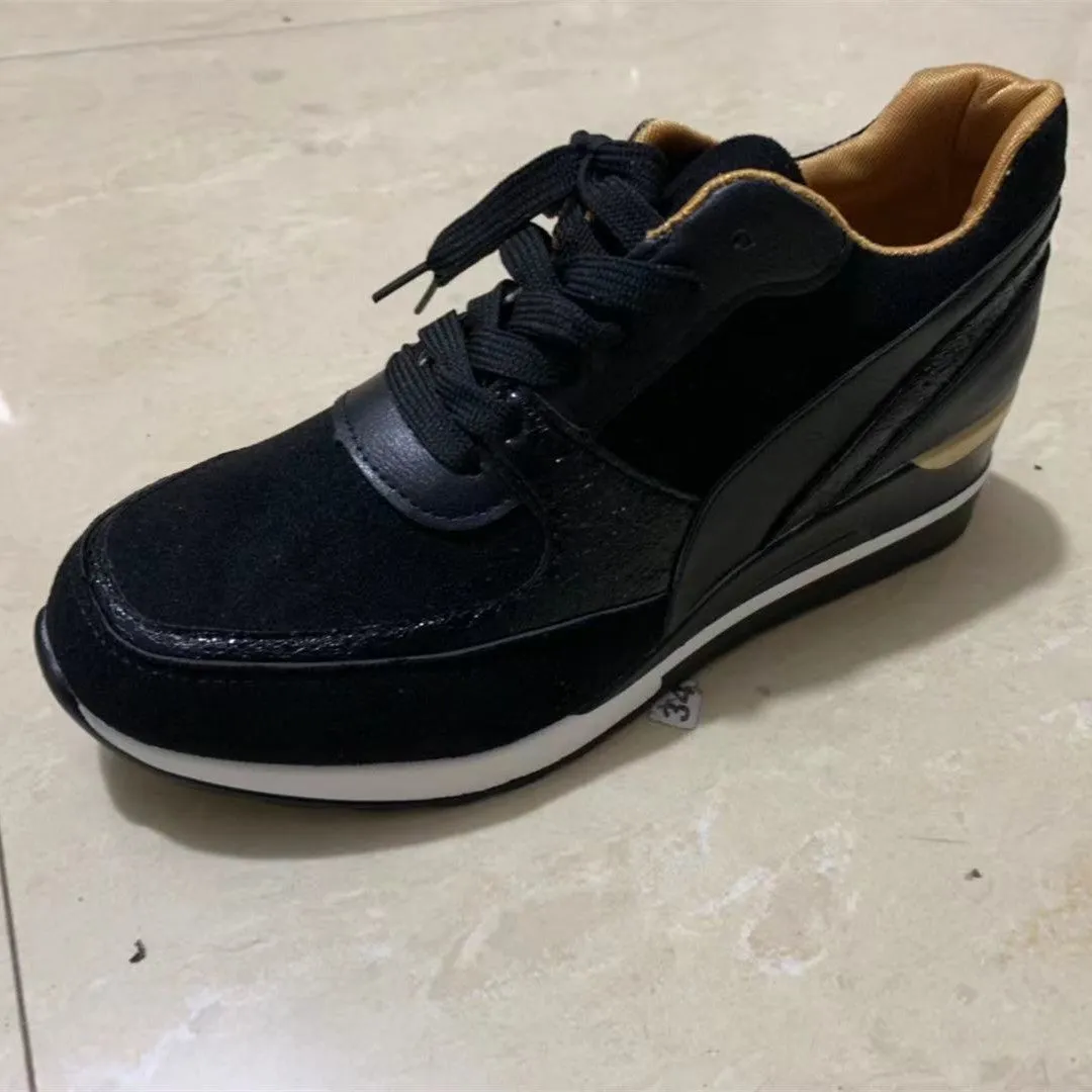 Women's black and gold platform colourblock sequin flat casual sneakers with lace-up closure on white background
