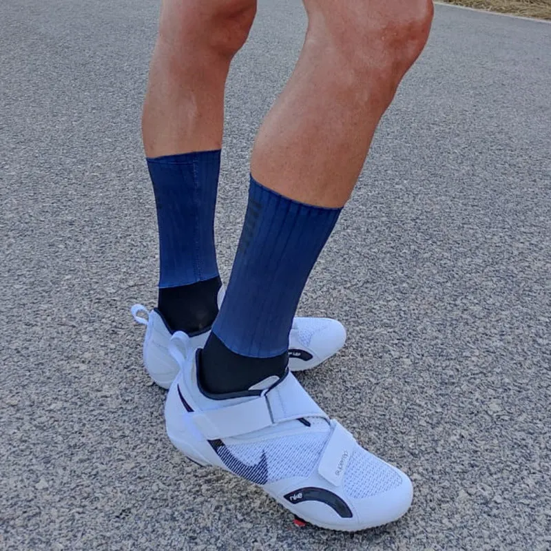A pair of athletic cycling socks in a chemical fibre blend, shown in one of six available colours on a plain background.