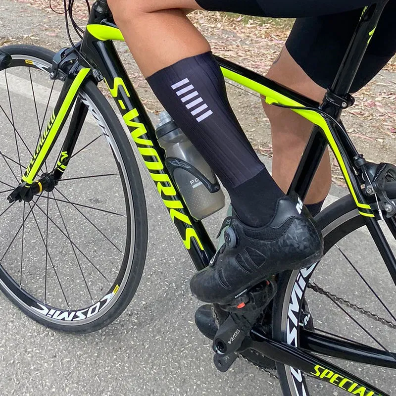 A pair of athletic cycling socks in a chemical fibre blend, shown in one of six available colours on a plain background.