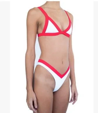 Women's split bikini with deep V neckline, front knot detail, and lace-up front in nylon, available in multiple colours