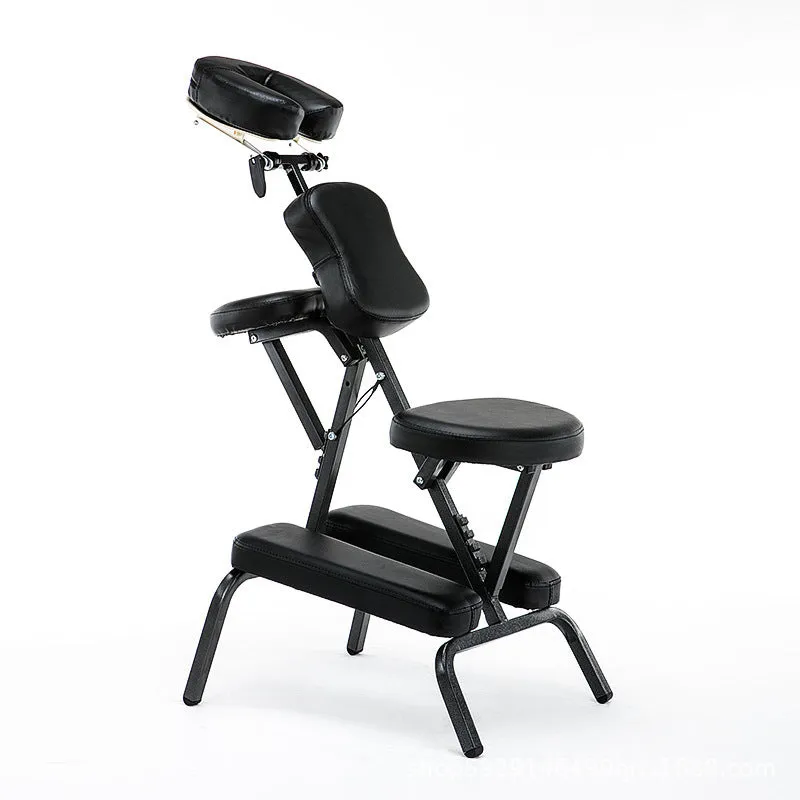 Folding massage chair in black with PVC leather seat and wood steel frame for tattooing and massage use