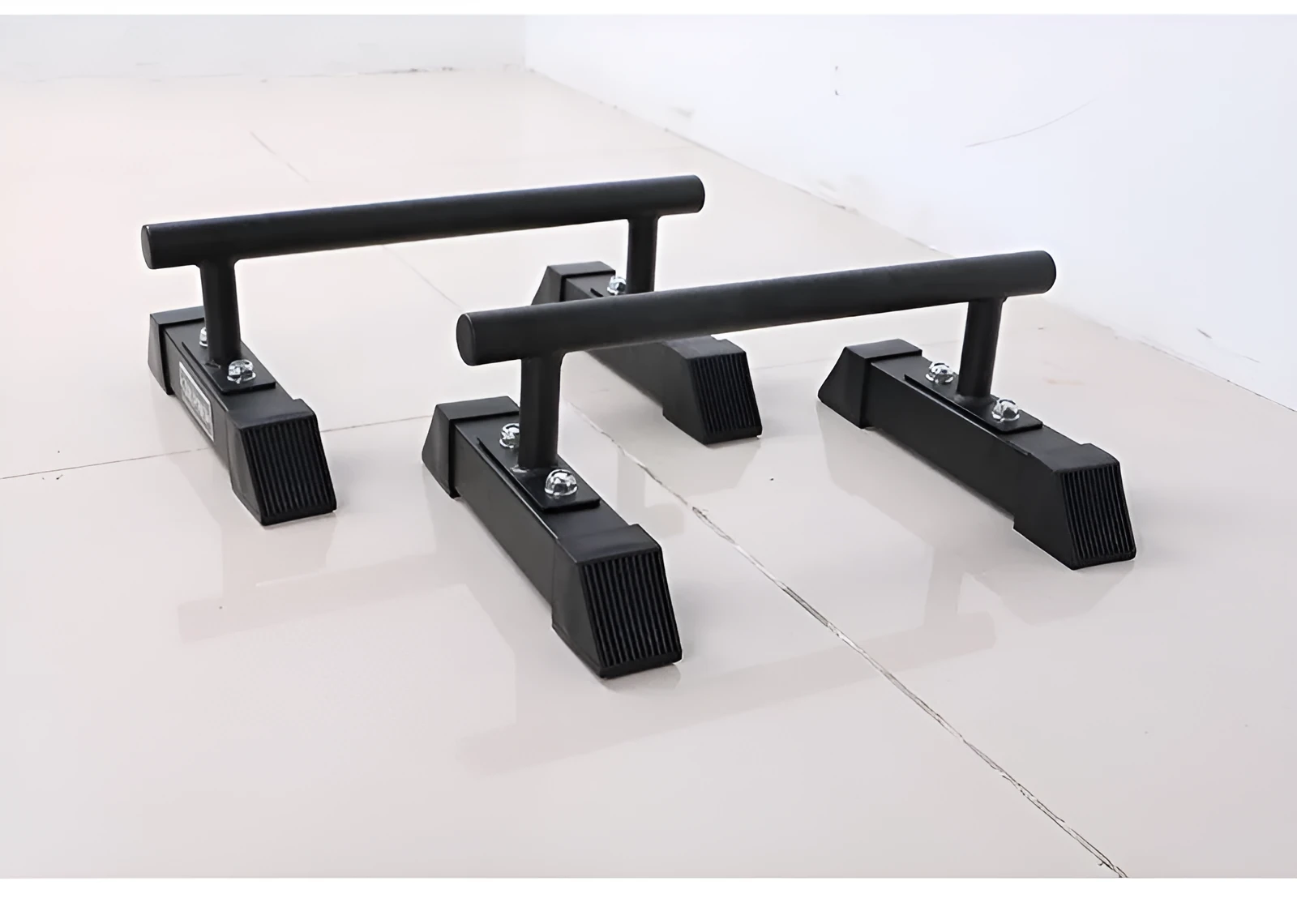 Black thick steel pipe parallel bars for home fitness measuring 35x20x20cm