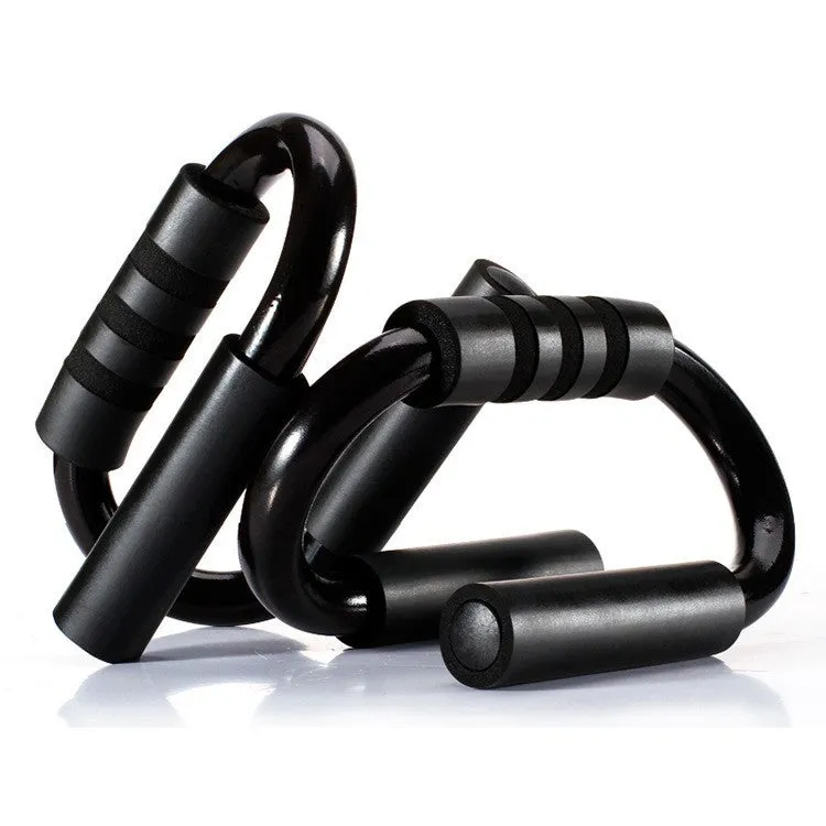 Black S shape push-up bracket rack on a home gym floor