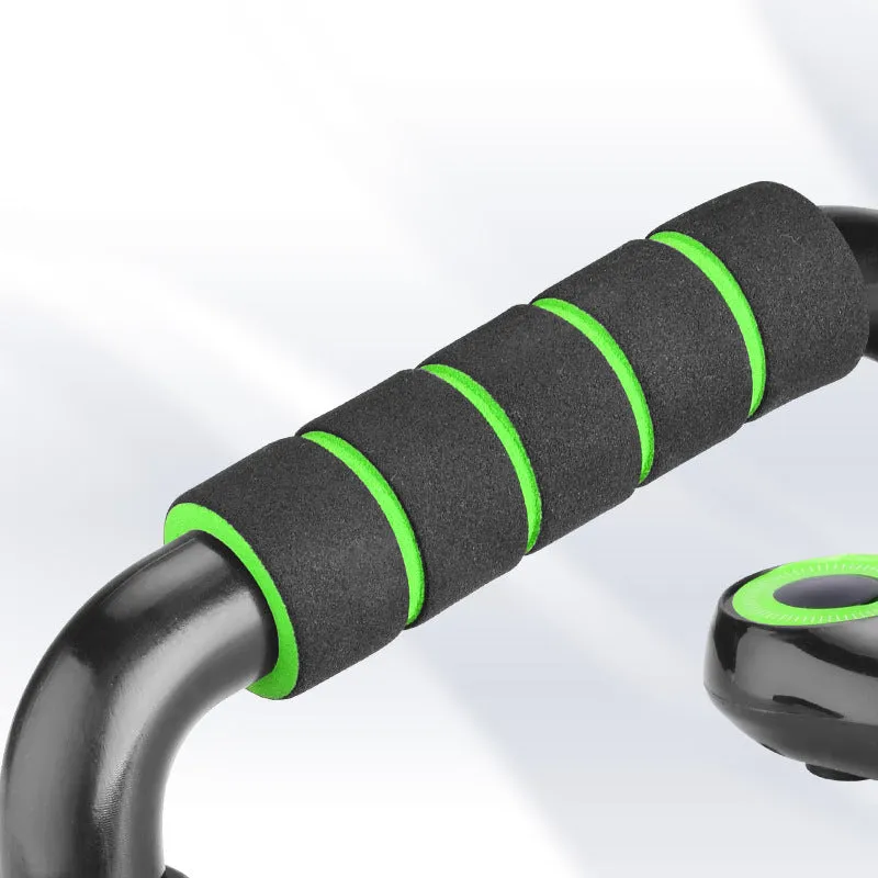 Multifunctional I-shaped detachable push up bars with black fruit green foam grip on a home gym floor
