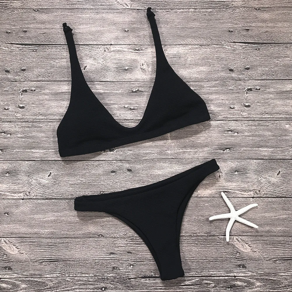 Women's solid low waist bikini set in black with padded wire-free top and stretch fabric