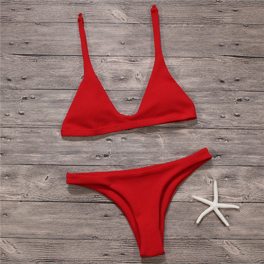 Women's solid low waist bikini set in black with padded wire-free top and stretch fabric
