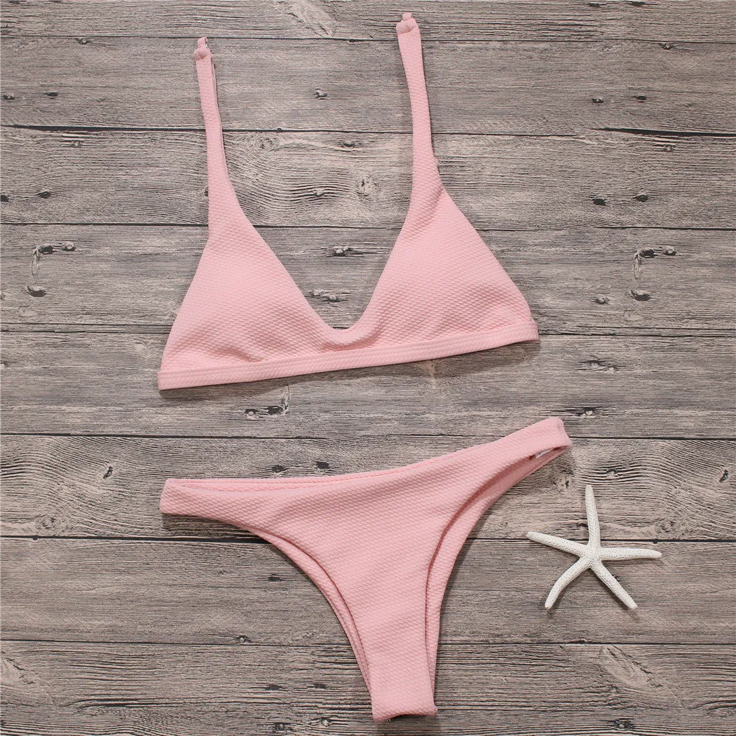 Women's solid low waist bikini set in black with padded wire-free top and stretch fabric