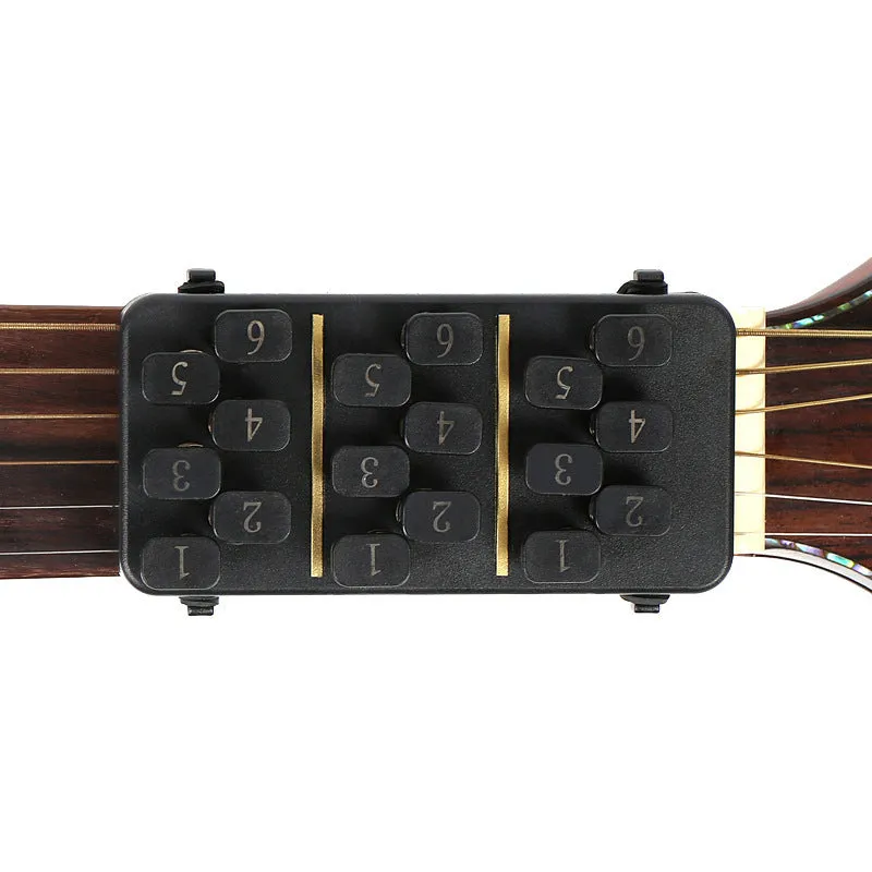 Guitar Aid plastic string press for guitar chord practice and rebound assistance