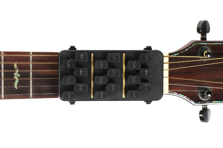 Guitar Aid plastic string press for guitar chord practice and rebound assistance