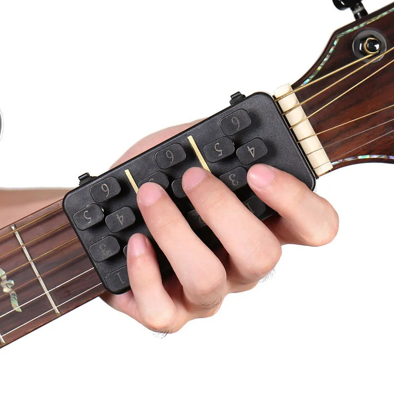 Guitar Aid plastic string press for guitar chord practice and rebound assistance