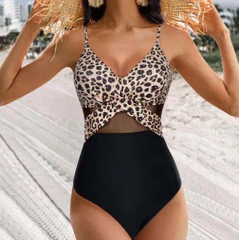 Halter-neck one-piece swimsuit with cross-strap back and mesh detail in solid colour