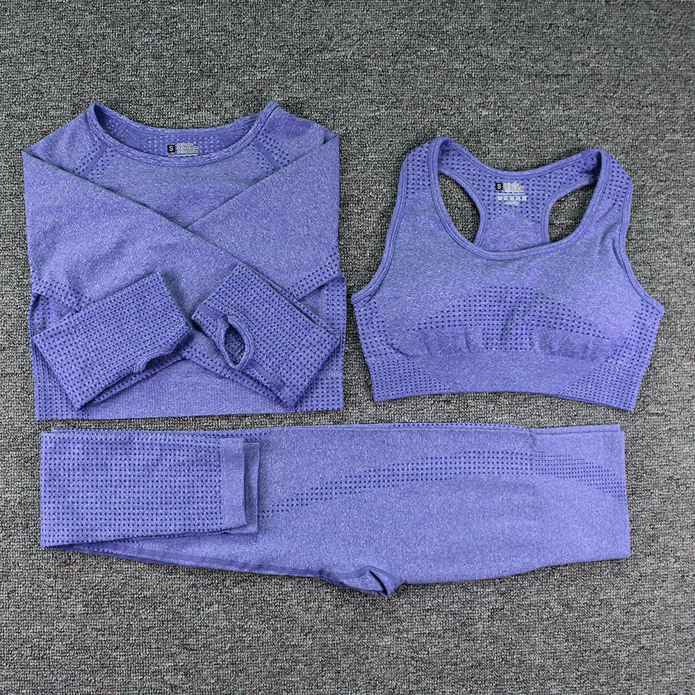 Three-piece yoga clothes set with bra, long sleeve top, and trousers in tight fit nylon blend fabric
