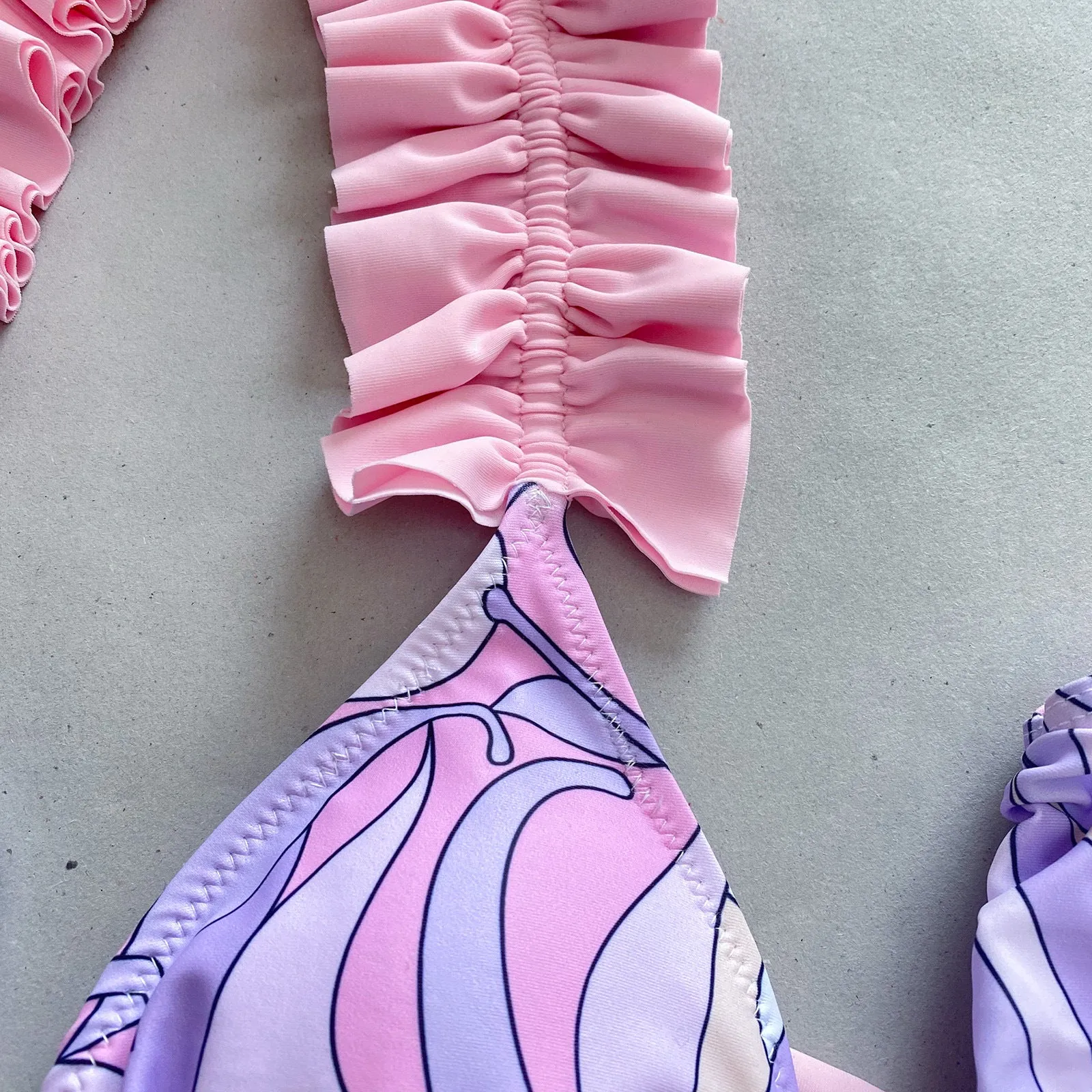 Women's pleated split bikini set in purple nylon and spandex, front view, size M