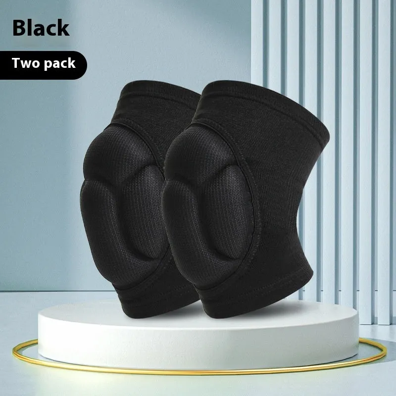 A pair of black thick sponge kneepads for dance and sports protection on a neutral background.