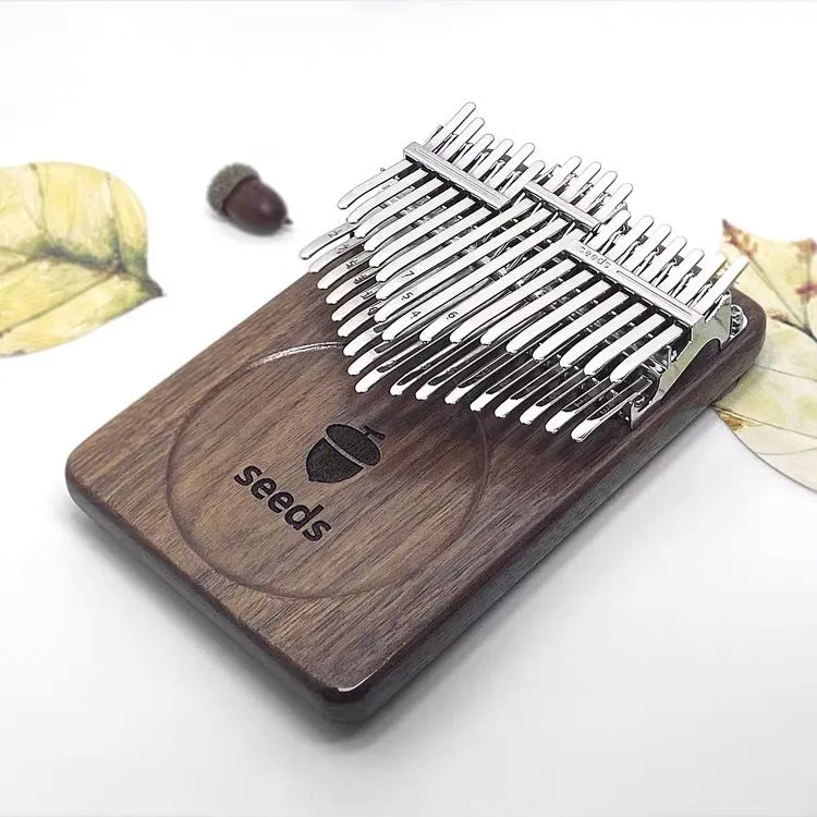 34-tone double-layer chromatic finger piano with black walnut plate, C key version on a neutral background