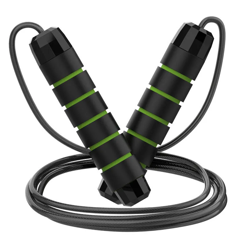 Steel wire jump rope with black PP handle on a dark background for fitness training