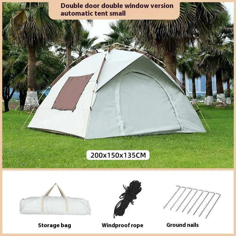Cloud gray outdoor automatic folding camping tent with two doors and two windows, set up on grass with waterproof rainfly