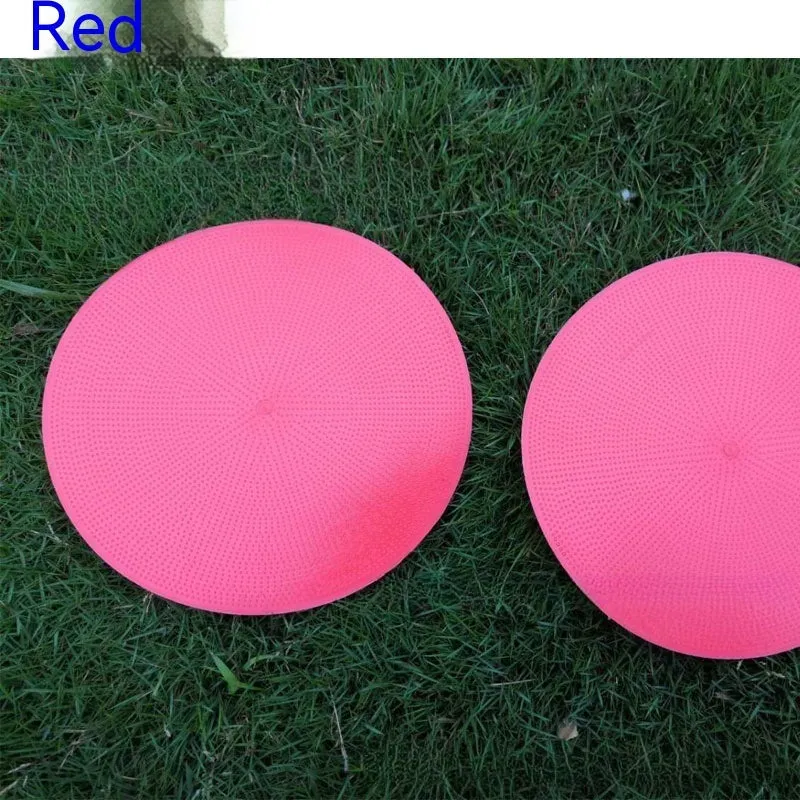Soft circular football training target pad in bright colours measuring 23cm across