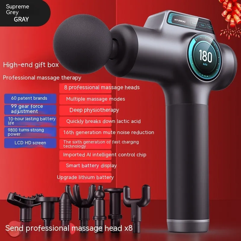 Grey mini massage gun with LED screen and four massage heads on a white background