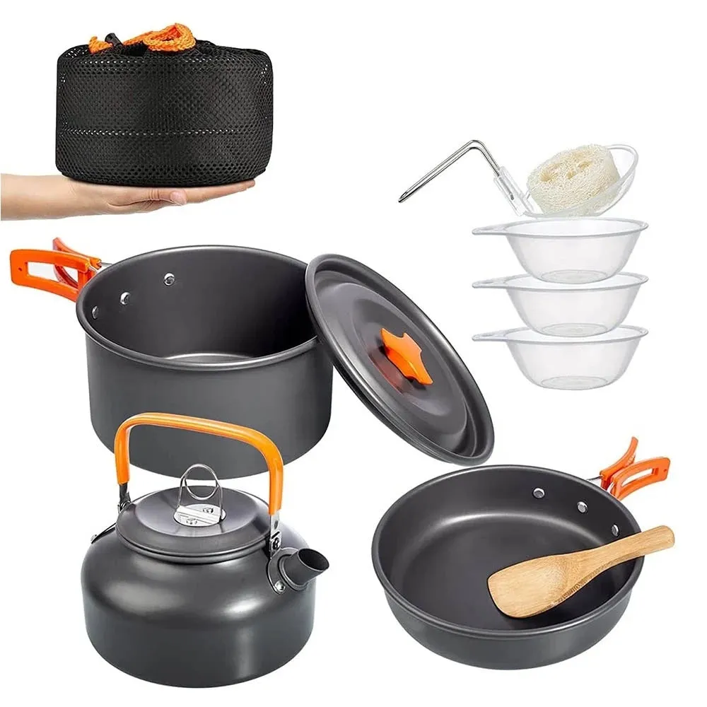 Orange camping cookware set with aluminium pots, pan, and utensils in a mesh bag
