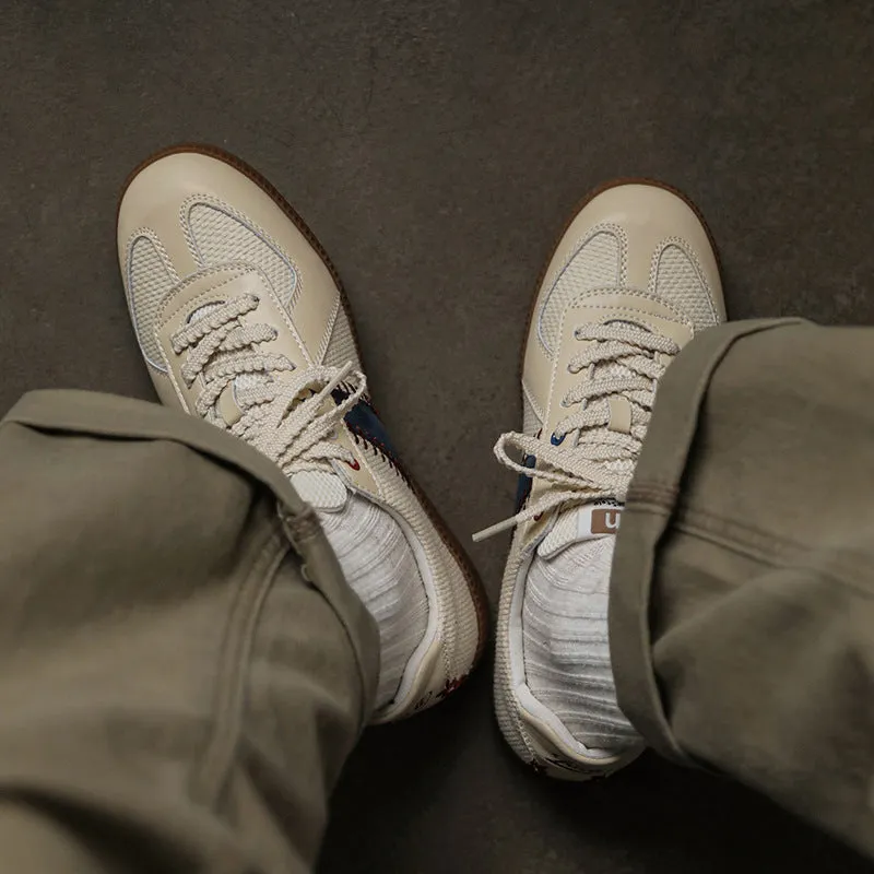 White mesh men's fashion casual exercise sneakers with flat heel on display