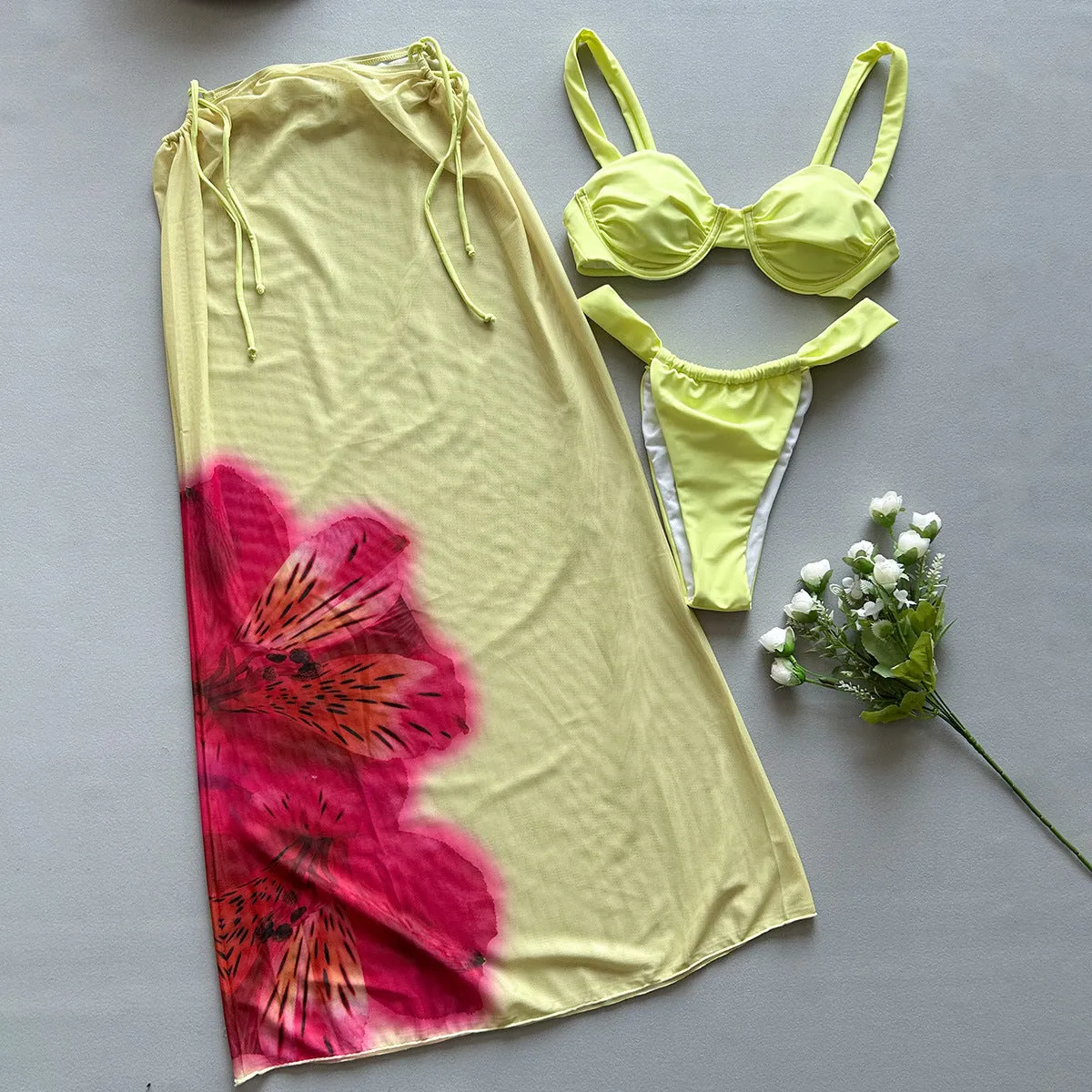 Three-piece women's bikini set in yellow print with split design, nylon fabric, and spandex lining, sizes S, M, L