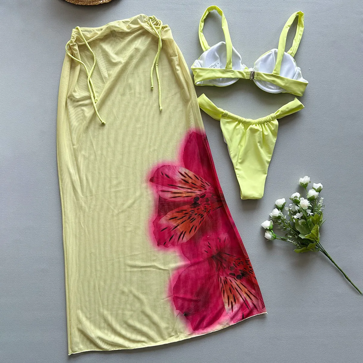 Three-piece women's bikini set in yellow print with split design, nylon fabric, and spandex lining, sizes S, M, L