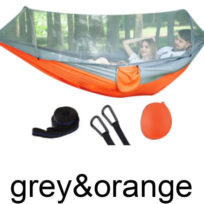 Double hammock bed 260x150cm in Army Green with mosquito-blocking mesh on a camping site