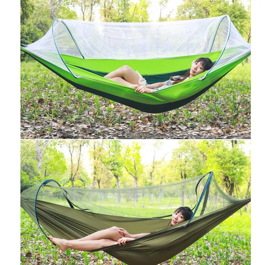 Double hammock bed 260x150cm in Army Green with mosquito-blocking mesh on a camping site