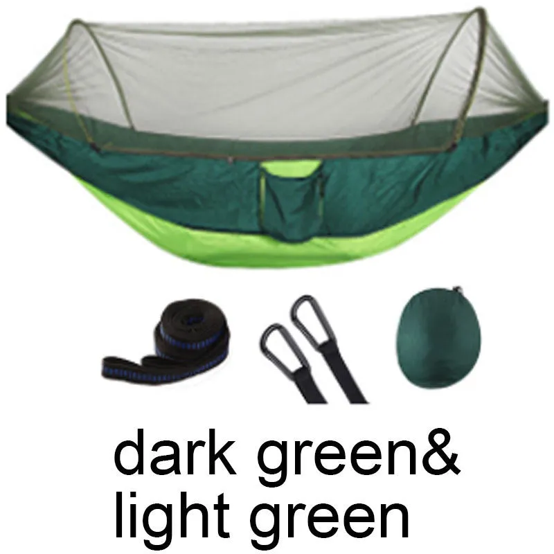 Double hammock bed 260x150cm in Army Green with mosquito-blocking mesh on a camping site