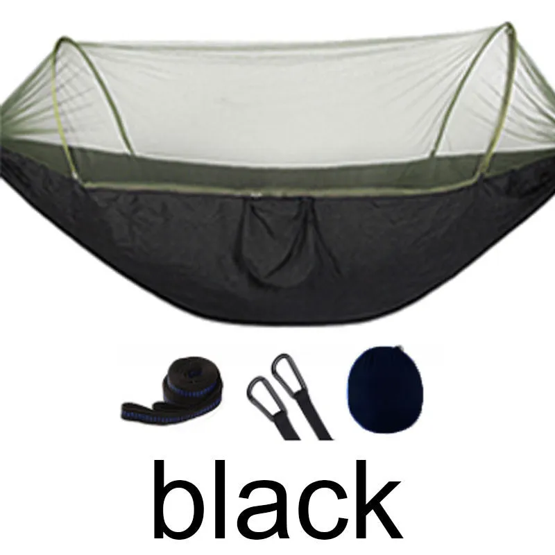 Double hammock bed 260x150cm in Army Green with mosquito-blocking mesh on a camping site
