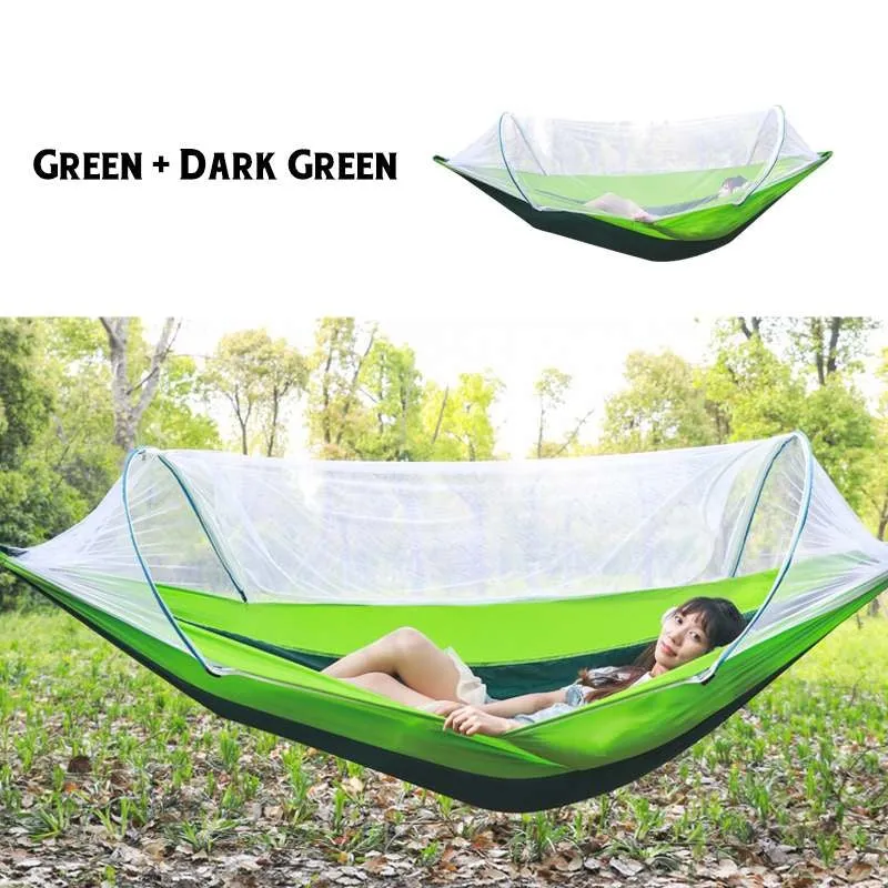 Double hammock bed 260x150cm in Army Green with mosquito-blocking mesh on a camping site