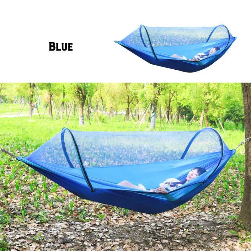 Double hammock bed 260x150cm in Army Green with mosquito-blocking mesh on a camping site