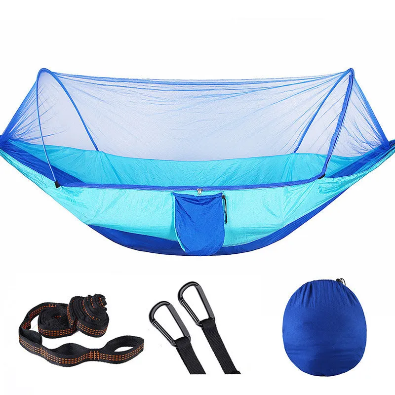 Double hammock bed 260x150cm in Army Green with mosquito-blocking mesh on a camping site