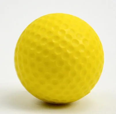 10 yellow PU foam indoor practice golf balls with 41mm diameter on a green surface