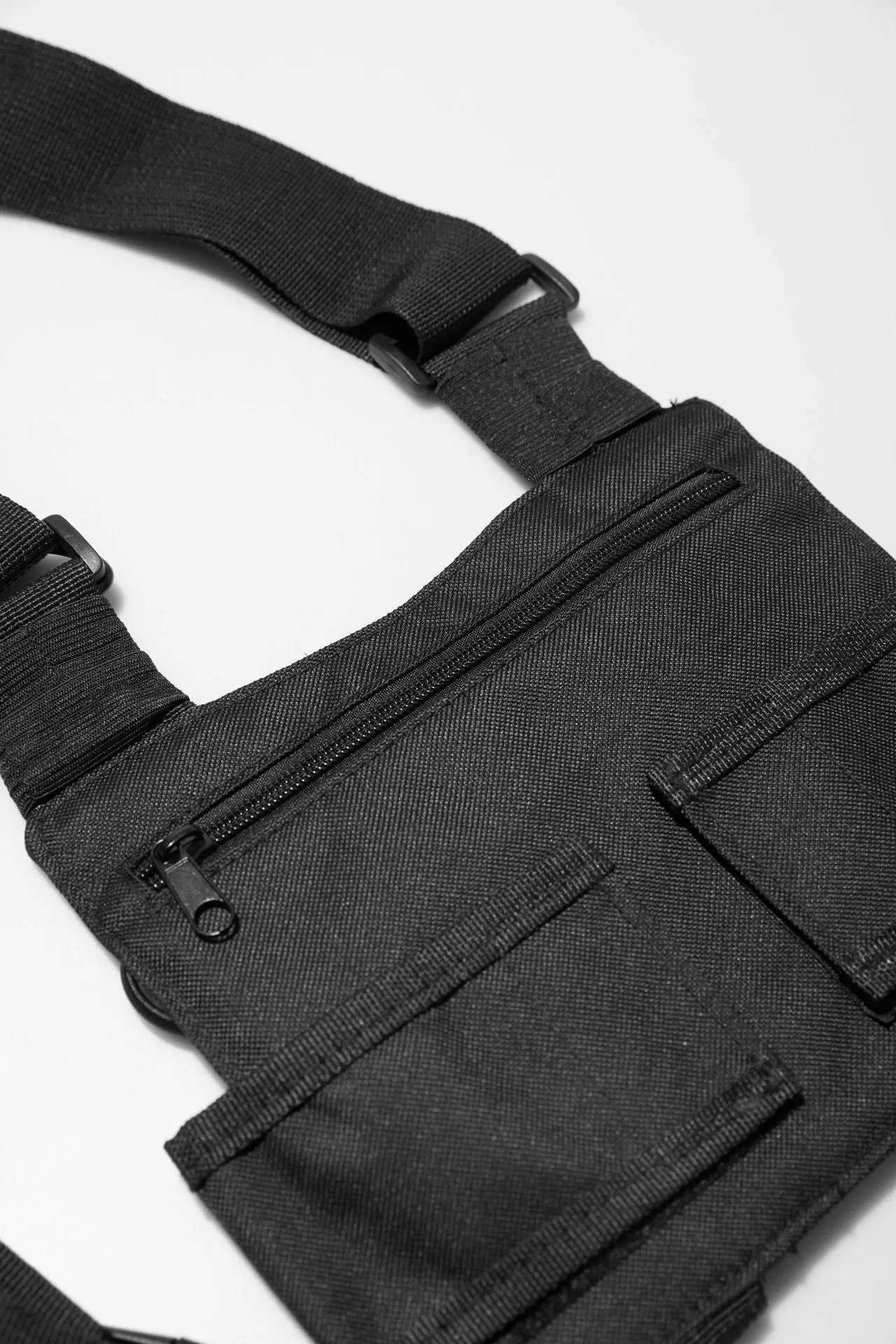 Black tactical tooling chest bag for men with Oxford cloth, striped pattern, and nylon lining