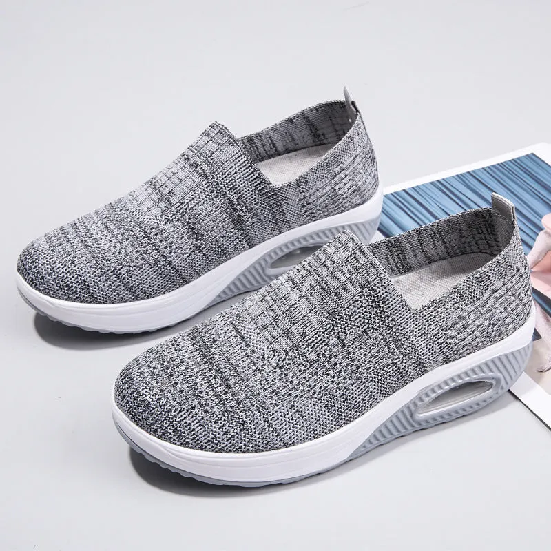 Women's beige casual running shoes with mesh upper and air cushion sole on a white background.