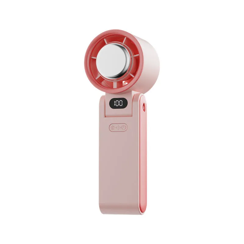 Folding handheld turbine fan with digital display and ice compress in gray, showing halter strap and USB port