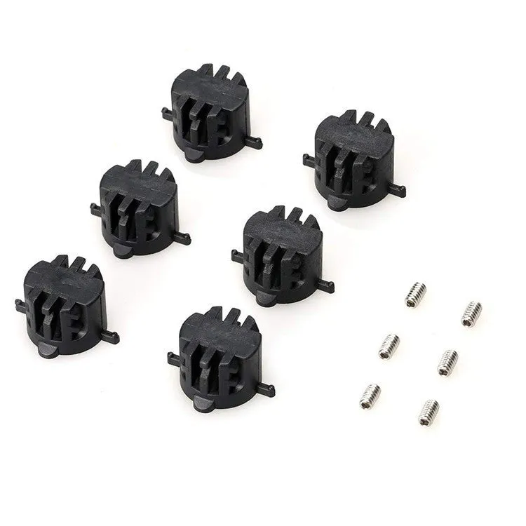 Set of six PVC surfboard G5 tail rudders in round cup design, black colour, on a flat surface
