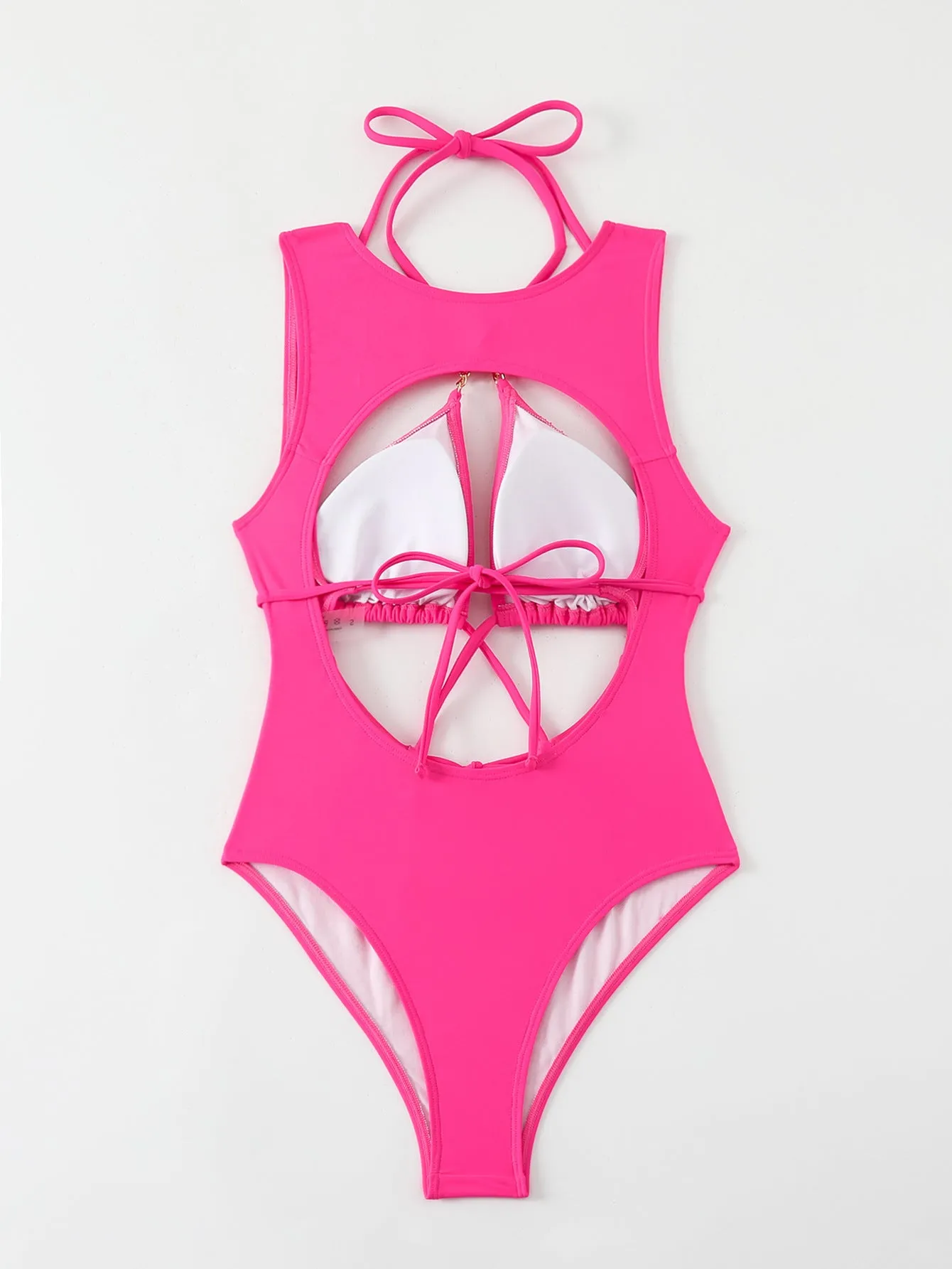 Bright pink nylon one-piece swimsuit with sexy cutout strap design for adult women