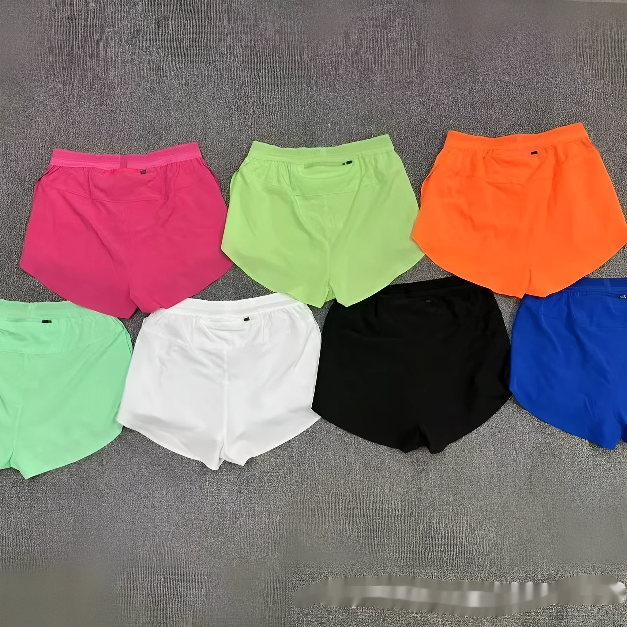 Pocket marathon running shorts with breathable lining in black, side view showing pockets and mid waist fit