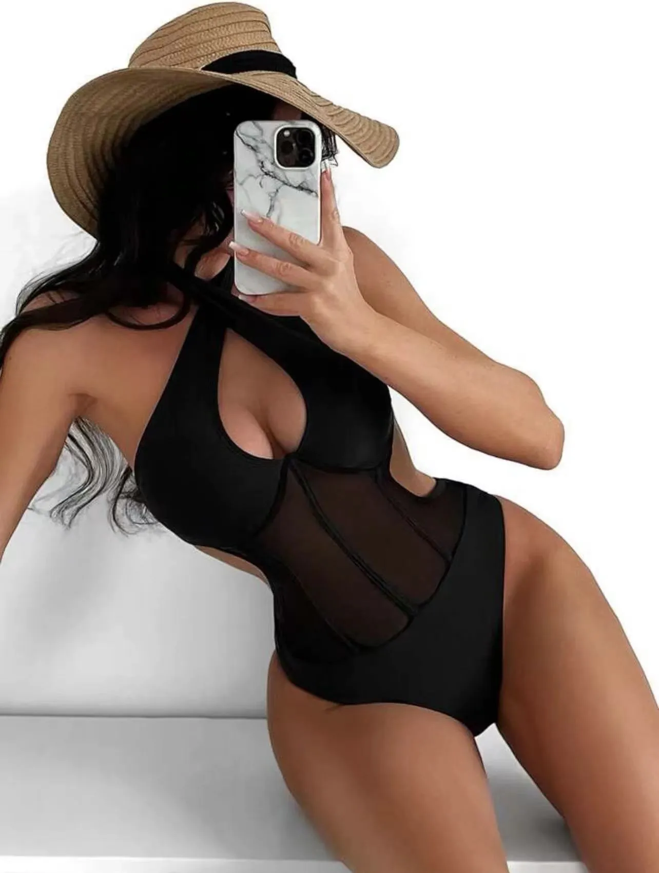 Women's black one-piece swimsuit with spun yarn nylon and spandex fabric on a mannequin.