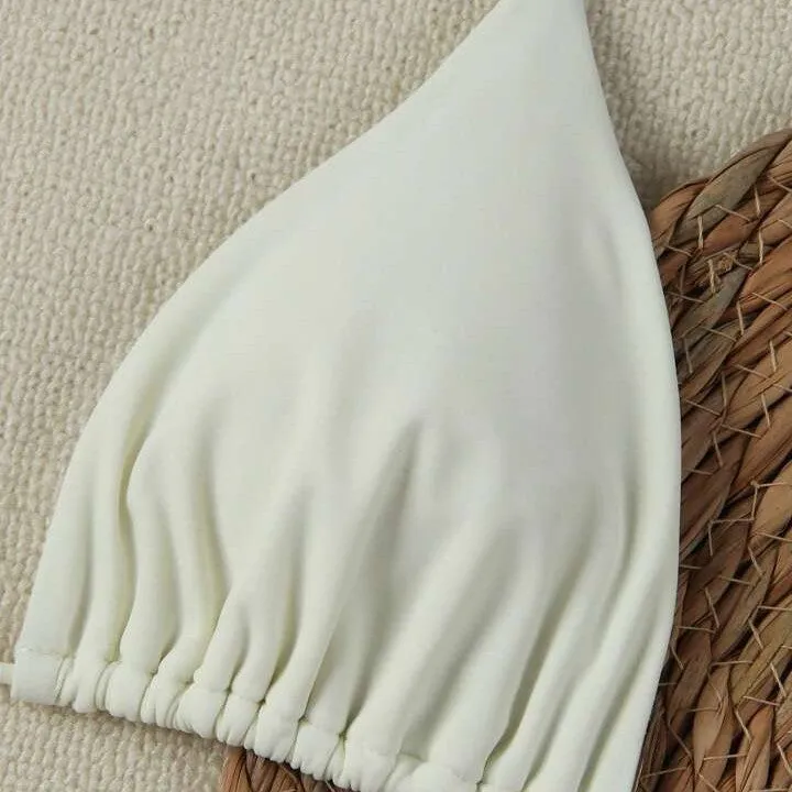 XINGX women's lace-up bikini swimsuit in creamy-white with nylon fabric and brief bottom for beach or hot spring use