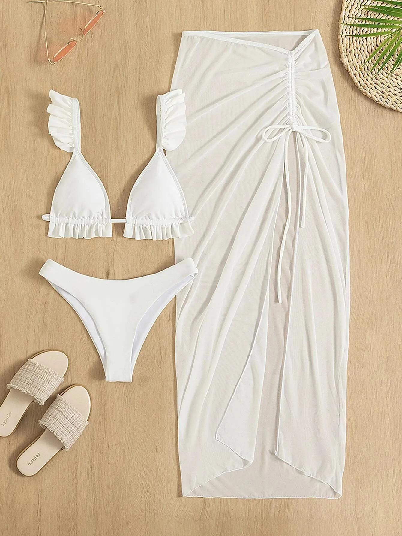 Three-piece bikini set with swim skirt in polyester fibre, showing triangle top, low waist briefs and matching skirt