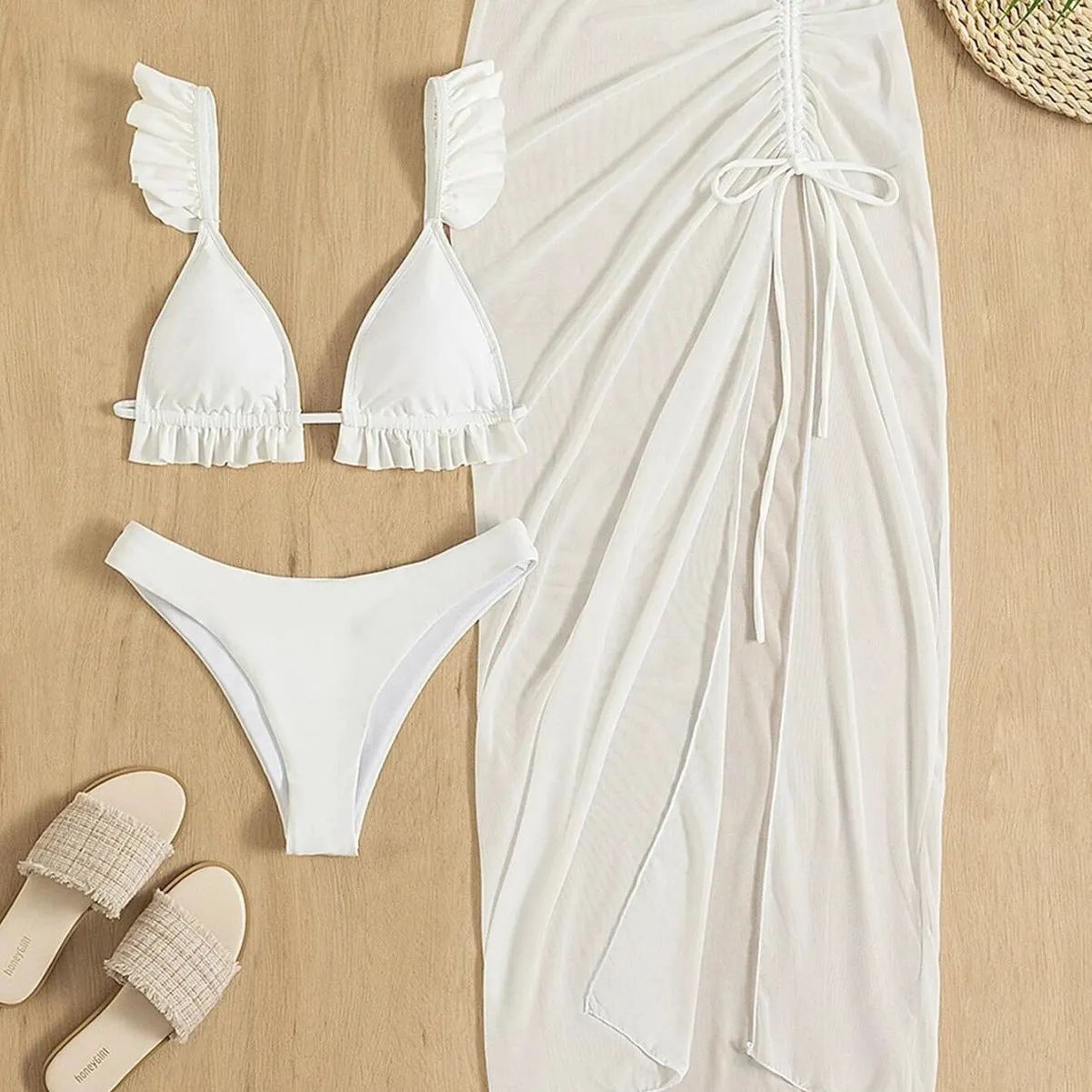 Three-piece bikini set with swim skirt in polyester fibre, showing triangle top, low waist briefs and matching skirt