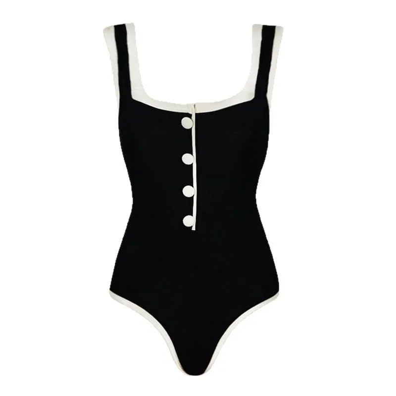 Black and white colour matching one-piece swimsuit with classic style belly coverage, backless design