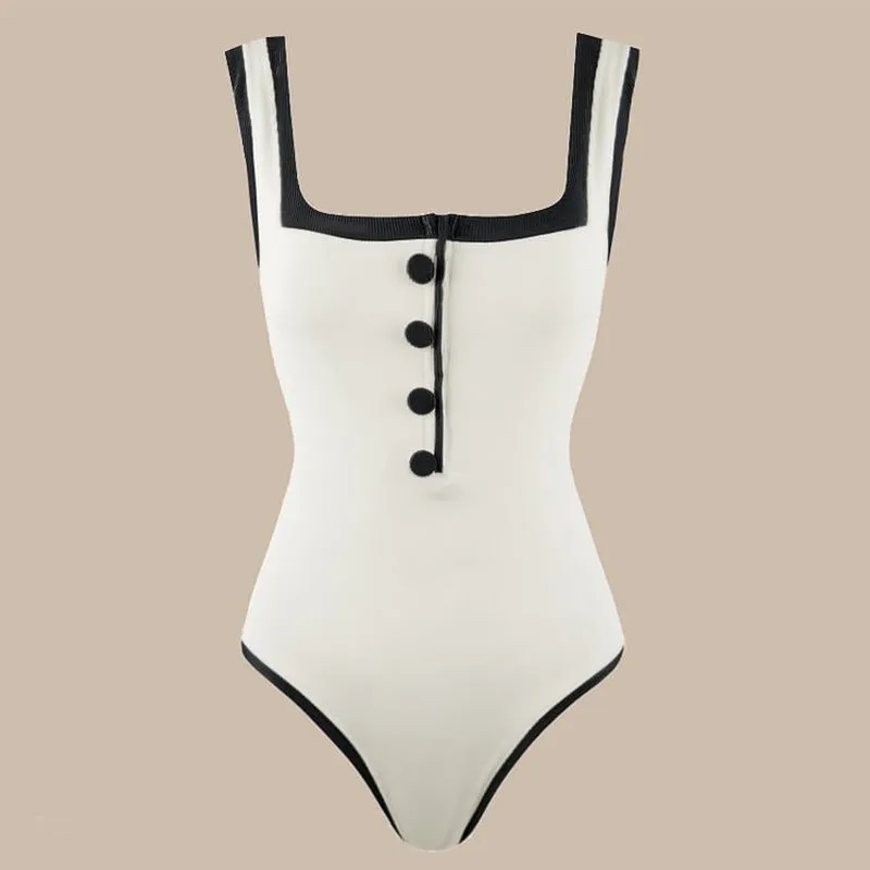 Black and white colour matching one-piece swimsuit with classic style belly coverage, backless design