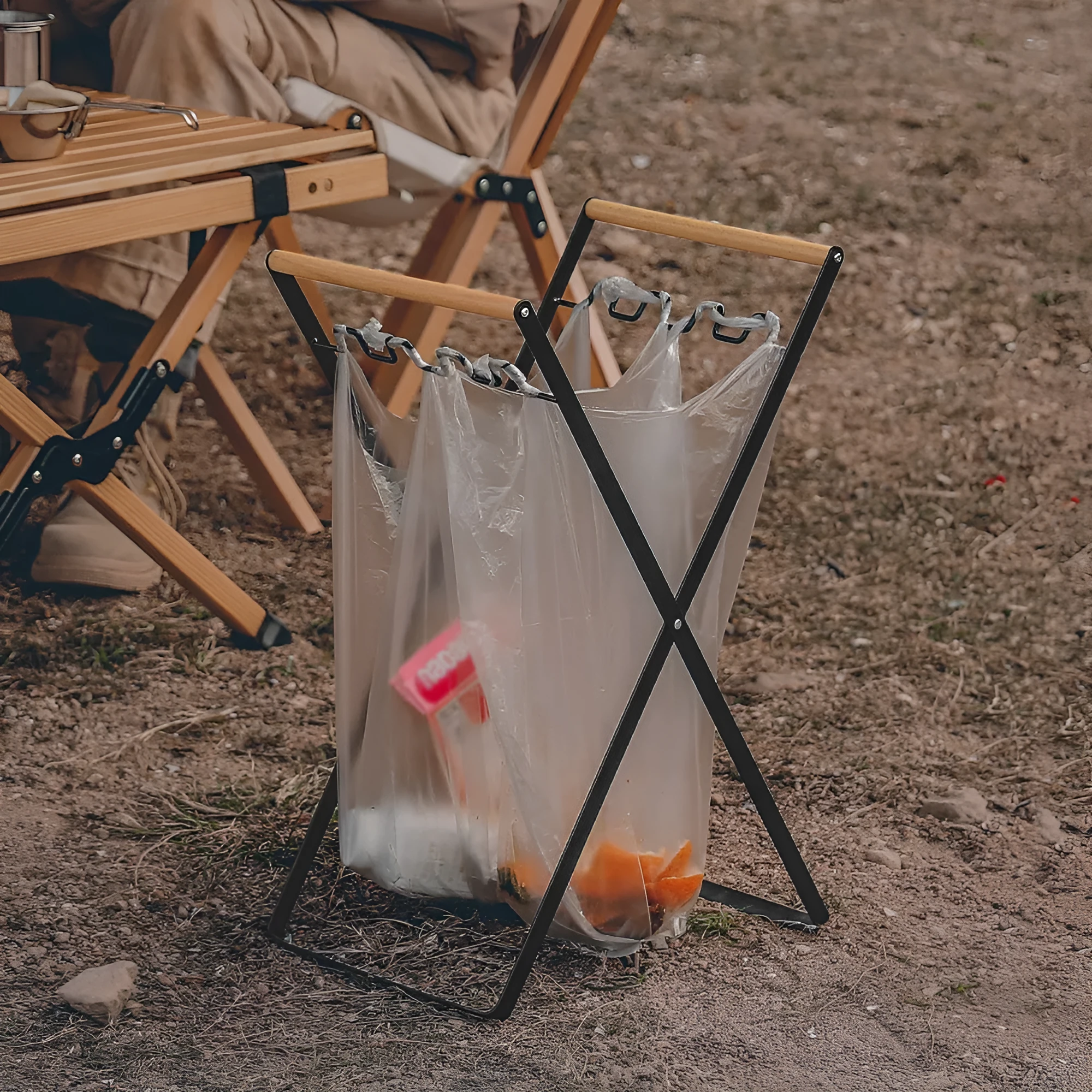 Foldable outdoor trash rack with wooden handle in black or white colour