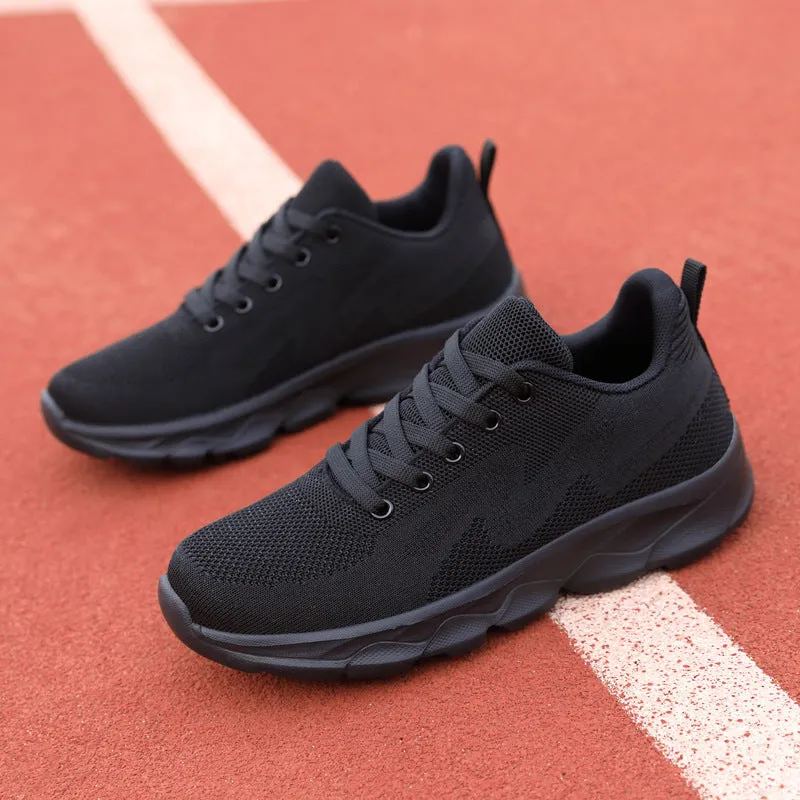 All black women's lightweight mesh sneakers with wedge heel and front lace-up design
