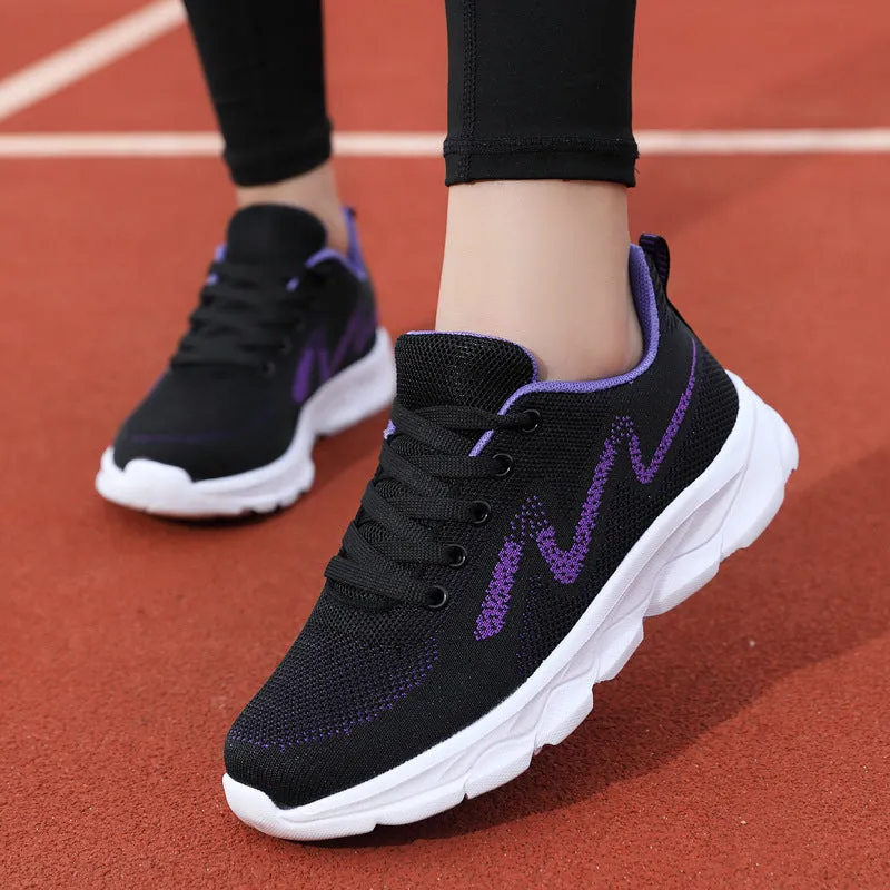 All black women's lightweight mesh sneakers with wedge heel and front lace-up design